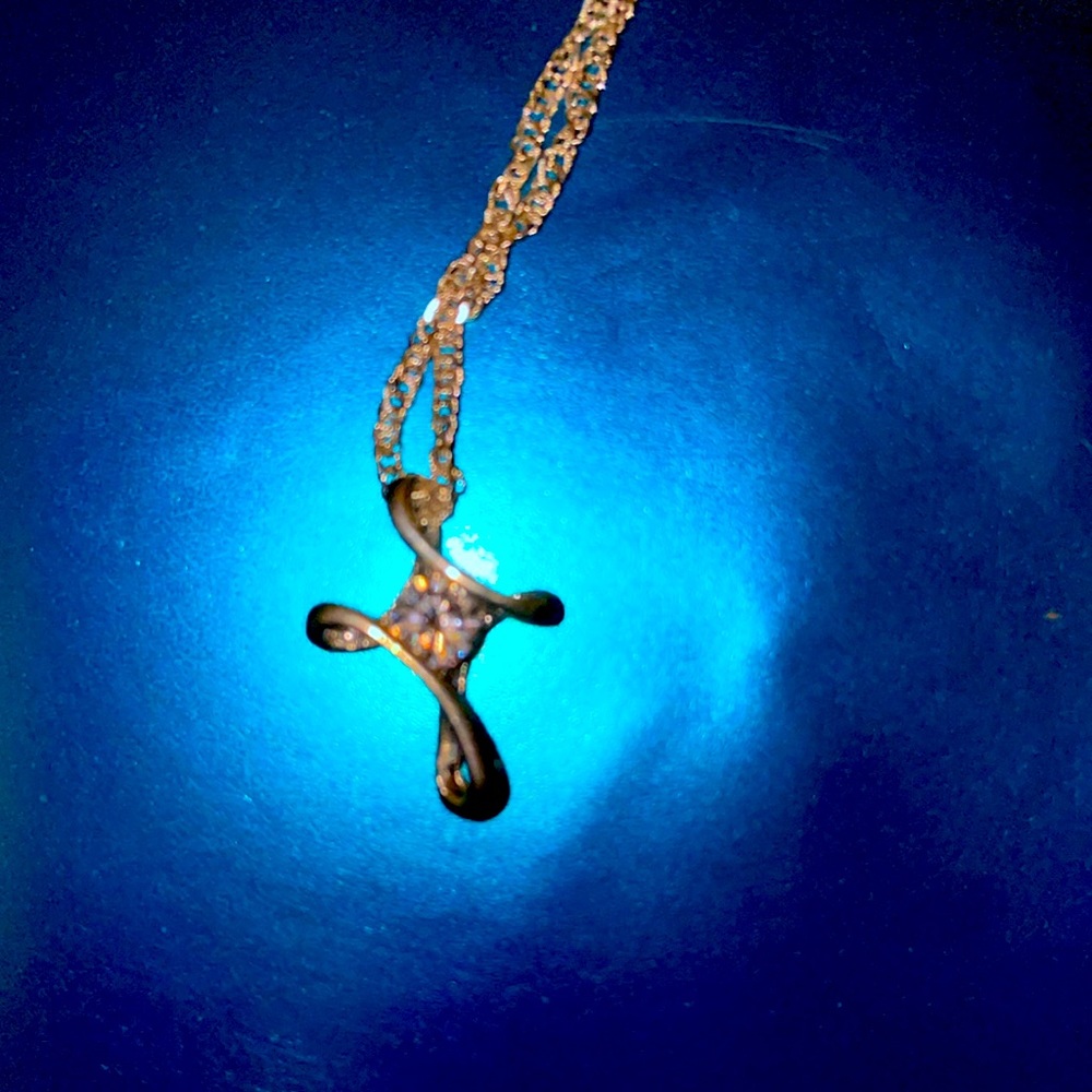Silver crossed with a rhinestone and silver chain